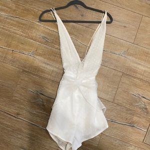 By the way. White low cut romper